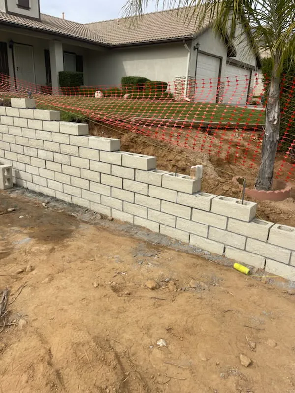 Block wall under construction in a residential yard