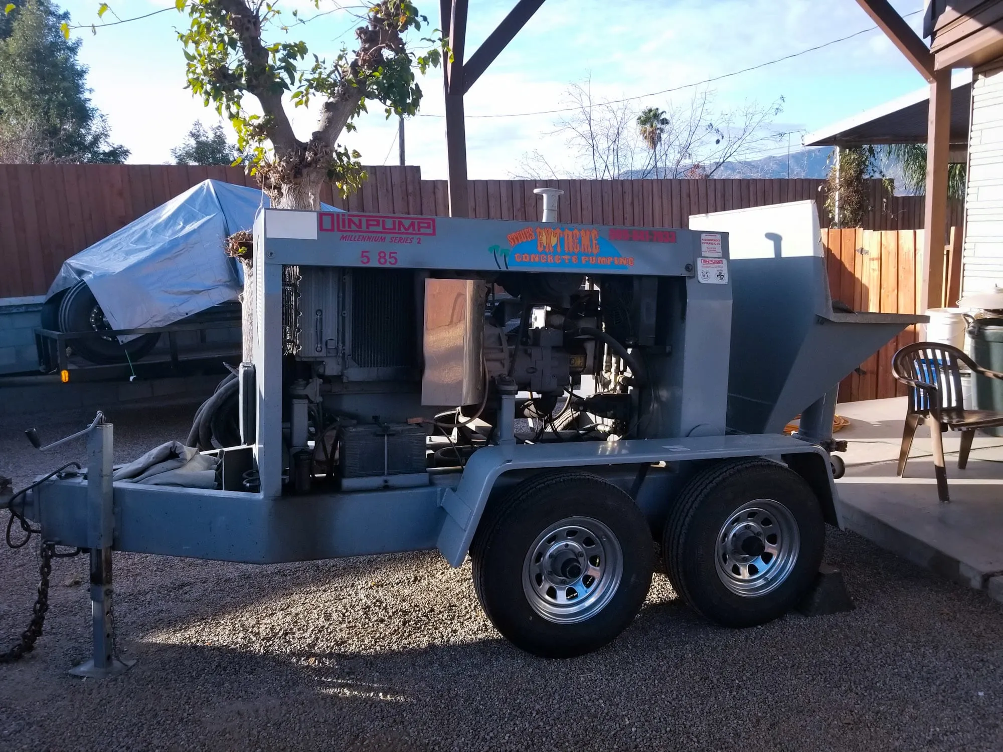 MZ Concrete Pumping trailer-mounted pea gravel concrete pump on a residential job